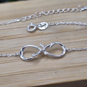 Pulseira de prata 925 com pingente infinito e flor entrelaçados com extensor - Imagem 4